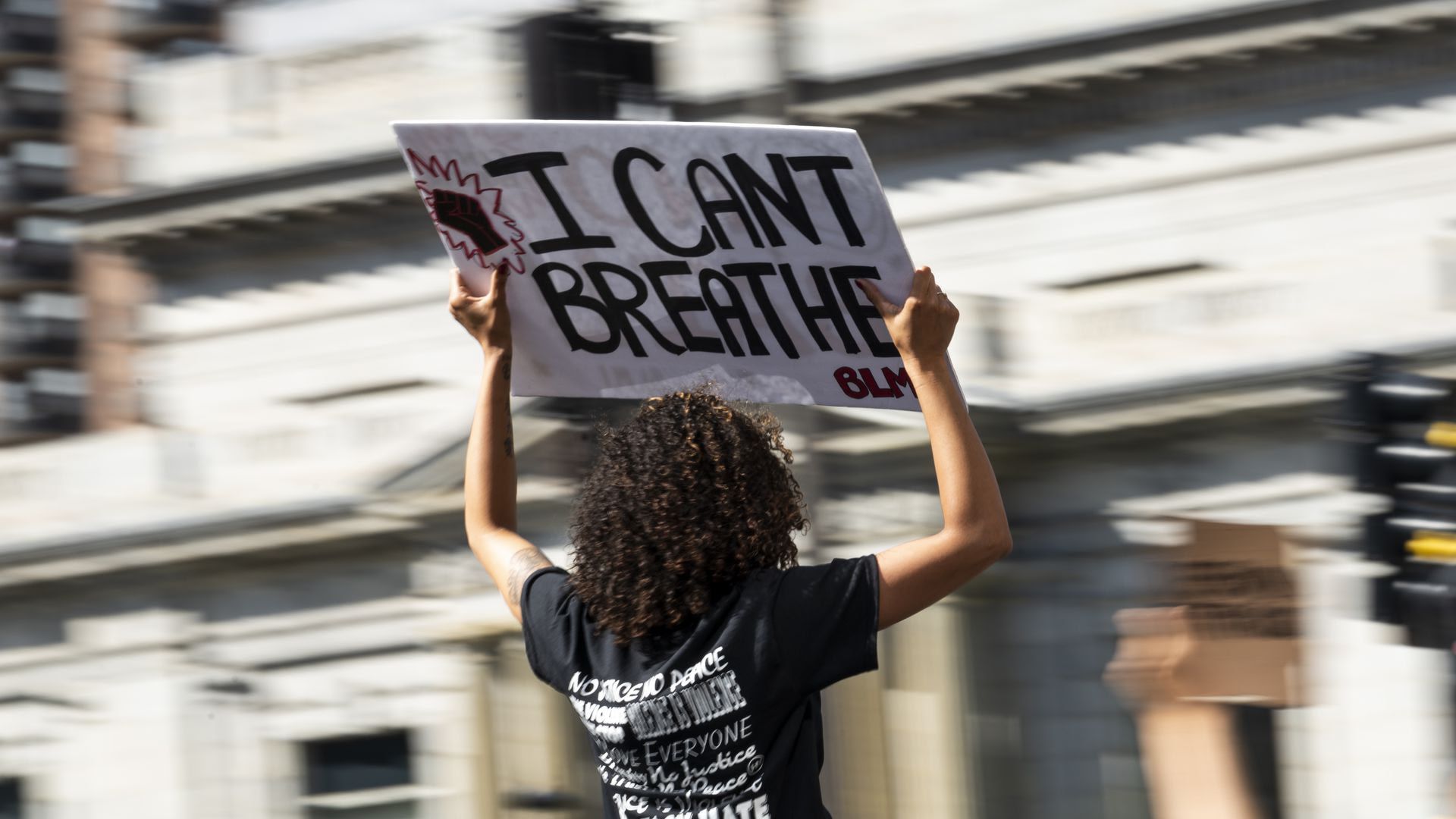 A protester holds a sign.
