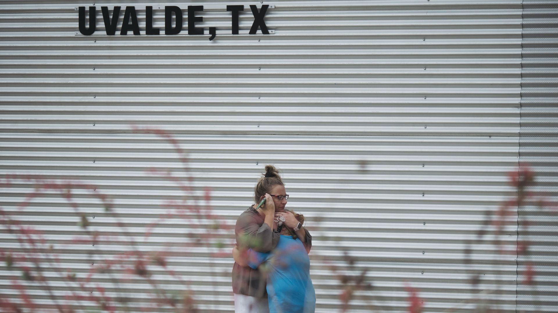 Mom hugs her daughter