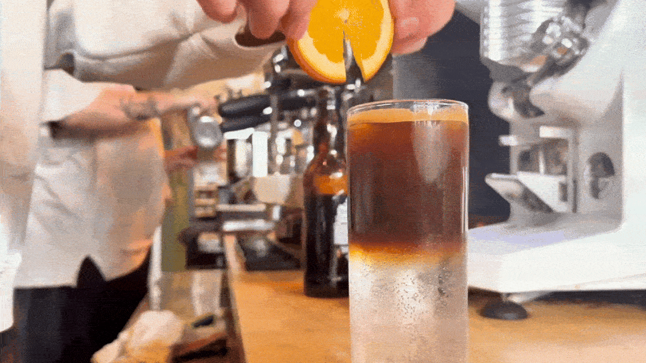 Final touches to an espresso tonic.