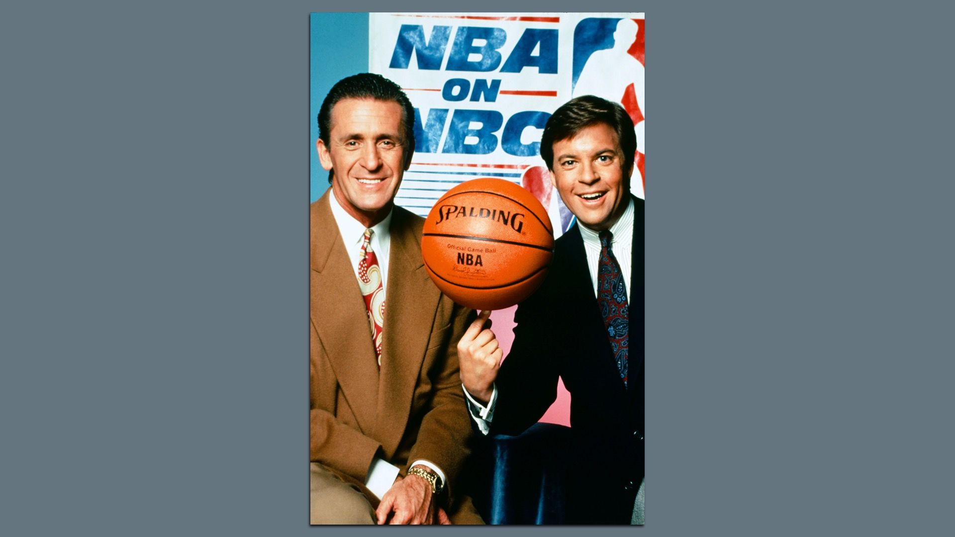 Left to right: A throwback photo of then NBC Sport's Pat Riley and play-by-play announcer Bob Costas, with a basketball balancing on his fingertip