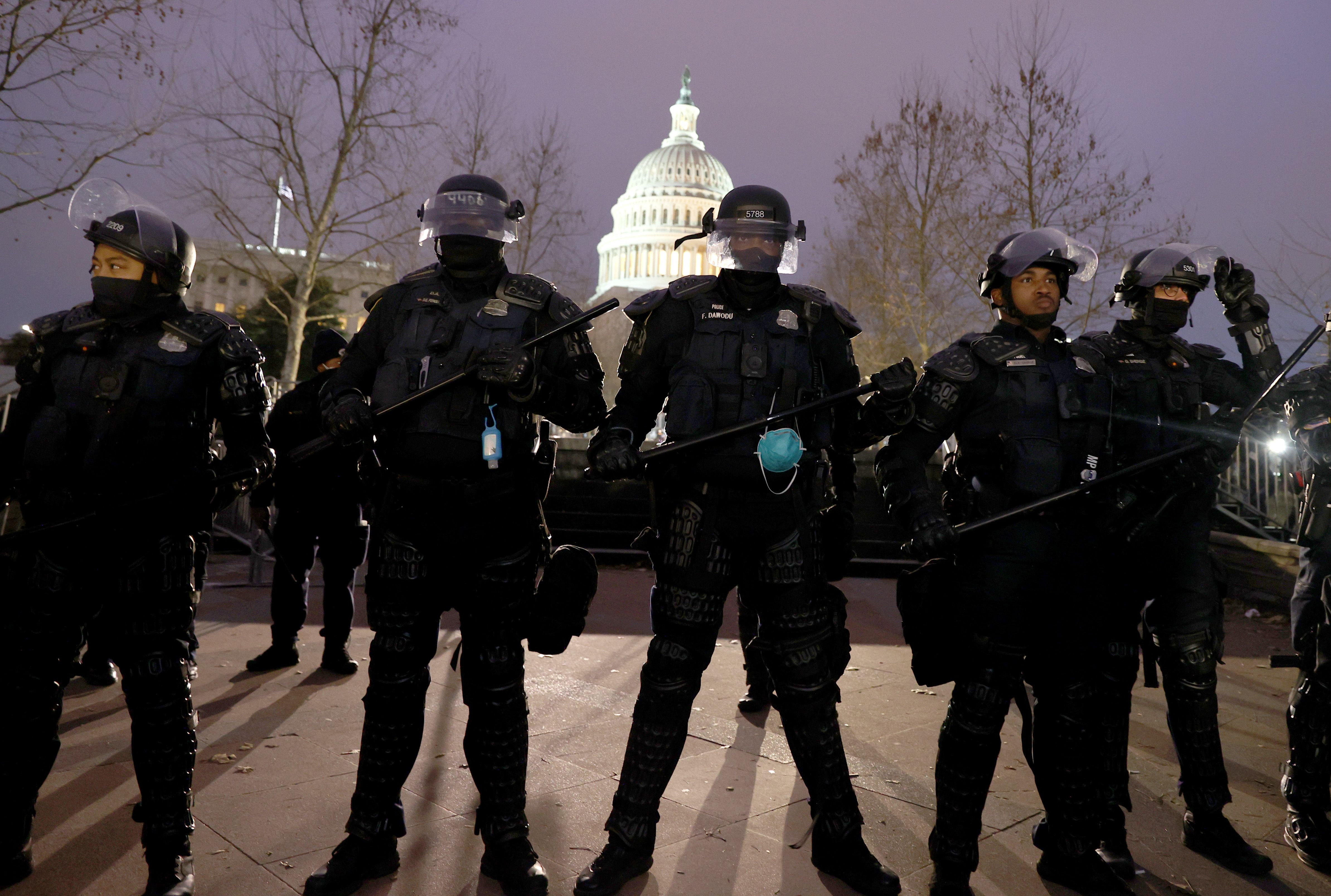 Police officers in riot gear line up as protesters gather on the U.S. Capitol Building on January 06, 2021 in Washington, DC