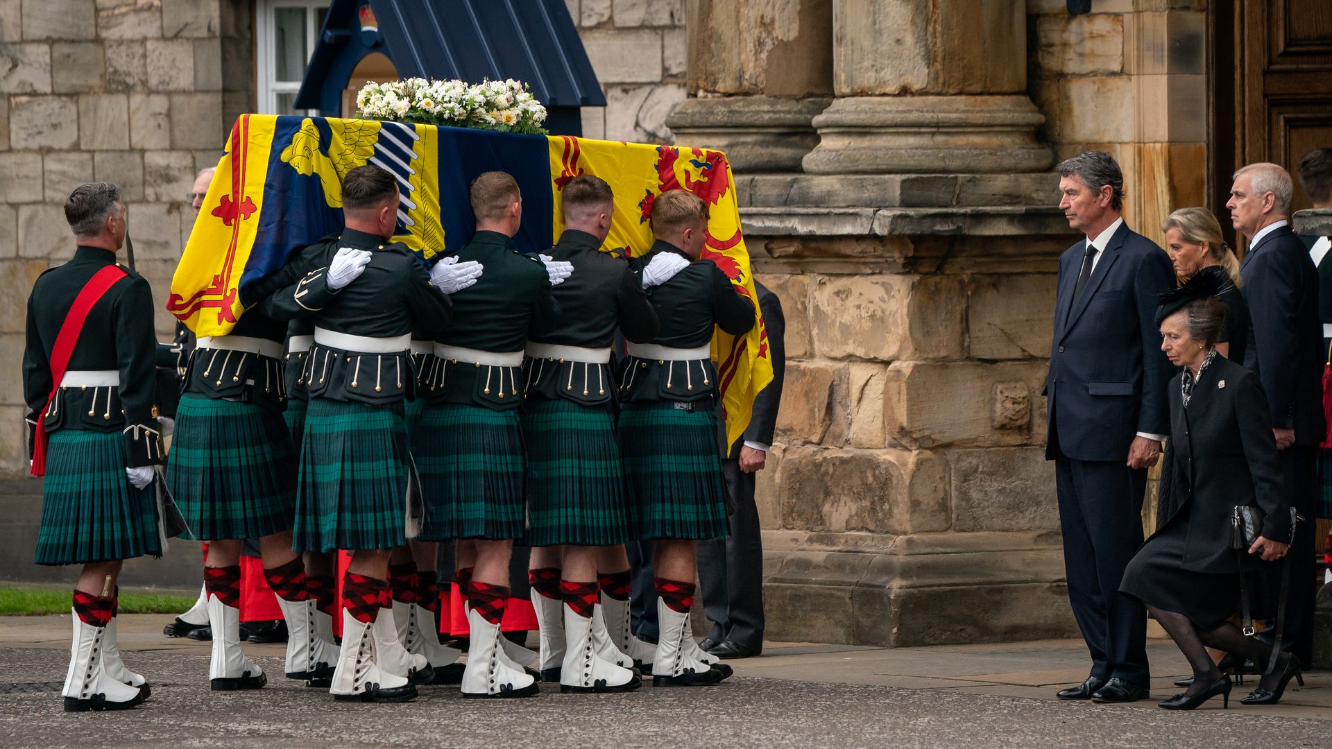 People carrying the queens coffin