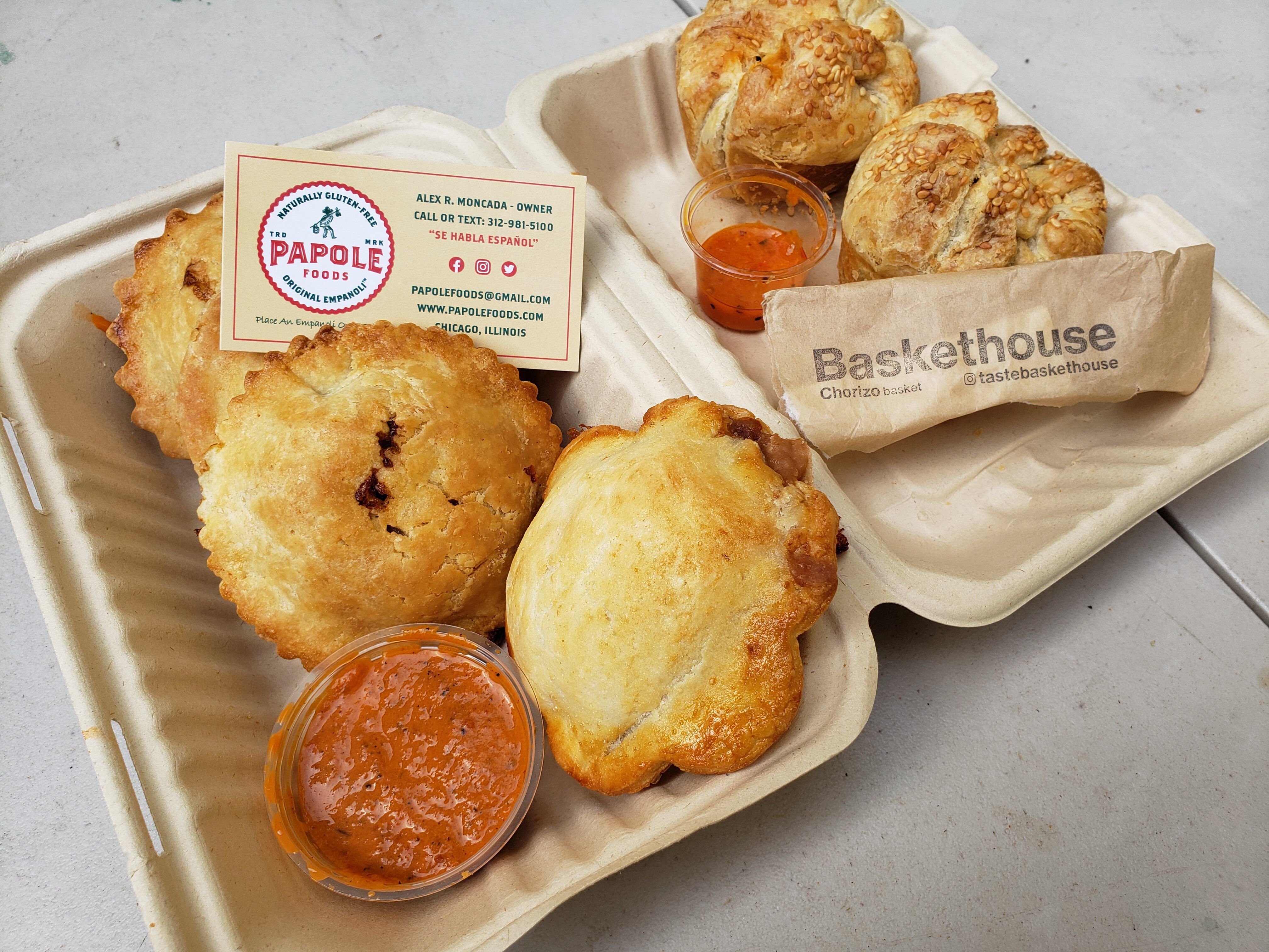 Photo of a bunch of pastries in a to go container.