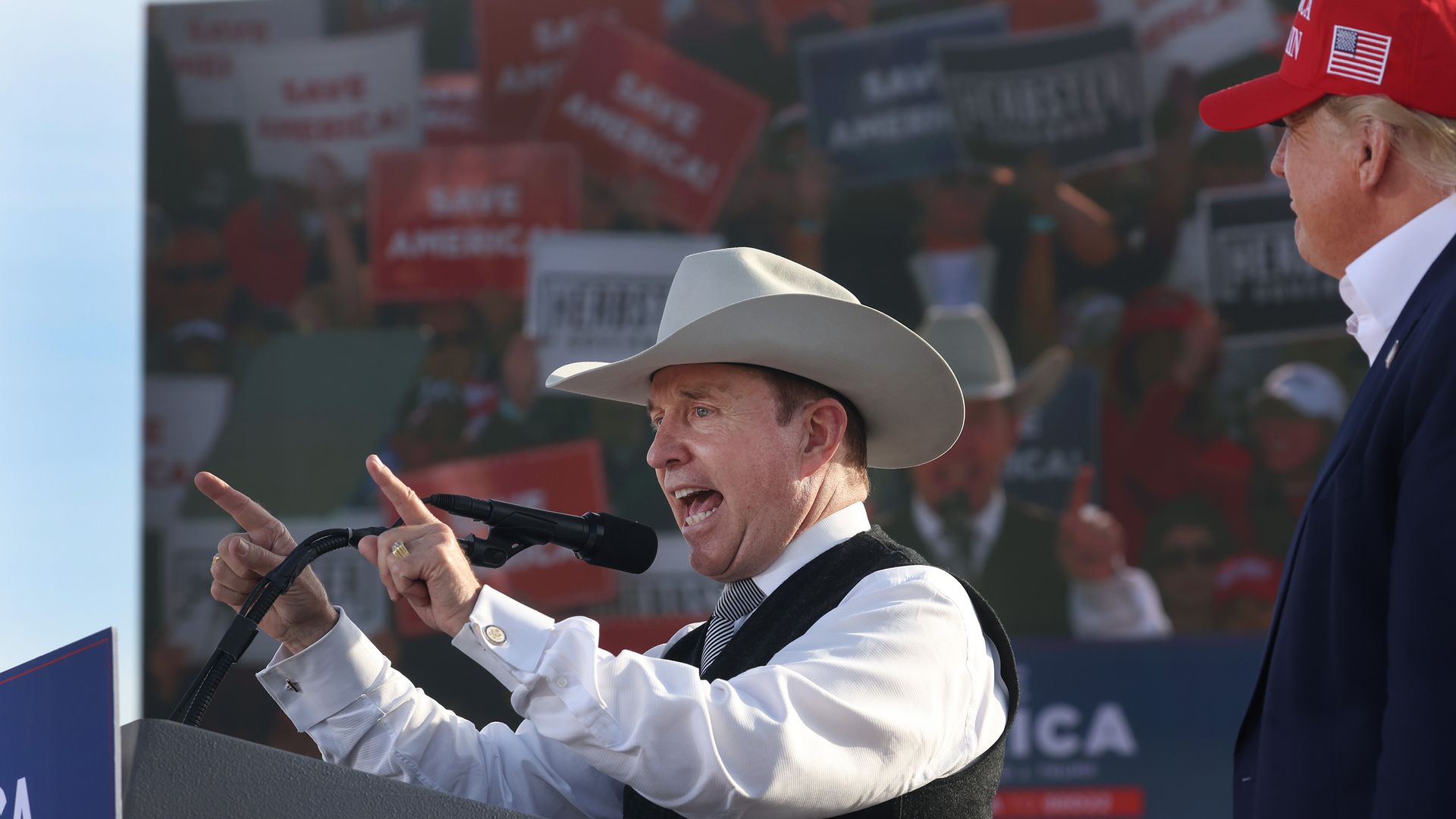 Former President Donald Trump listens as Nebraska gubernatorial candidate Charles Herbster speaks during a rally at the I-80 Speedway on May 01.