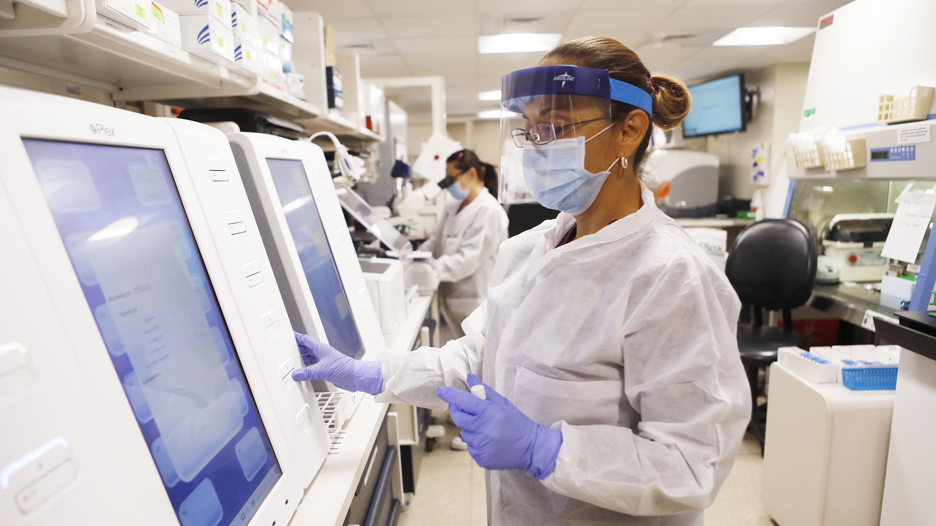 Adriana Cardenas, a medical technologist processes test samples for the coronavirus at the AdventHealth Tampa labs on June 25, 2020 in Tampa, Florida.