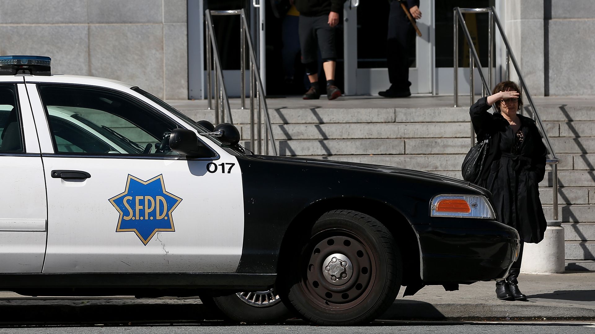 Photo of a San Francisco police car in front of a courthouse