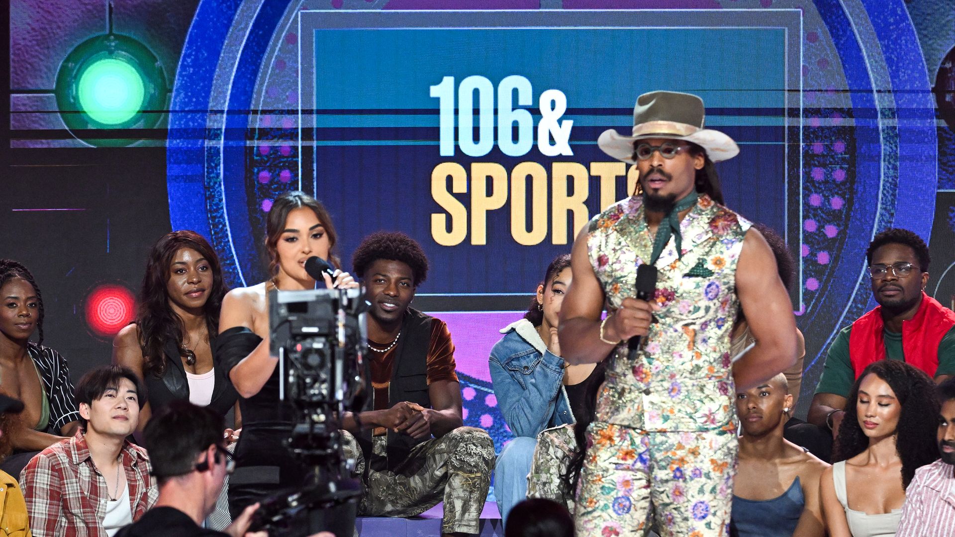 Ashley Nicole Moss and Cam Newton speak onstage during the 2025 BET Awards at Peacock Theater on June 09, 2025 in Los Angeles, California. 