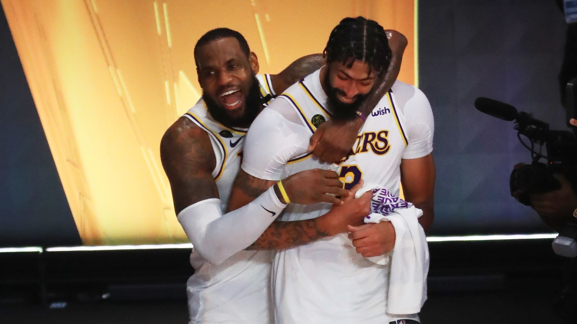 LeBron James #23 of the Los Angeles Lakers and Anthony Davis #3 of the Los Angeles Lakers react after winning the 2020 NBA Championship