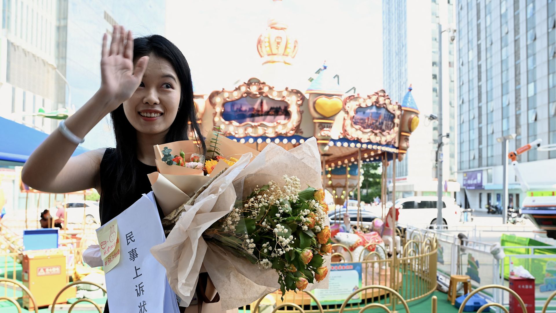 Zhou Xiaoxuan gestures as she arrives to attend a hearing in her sexual harassment case against prominent television host Zhu Jun