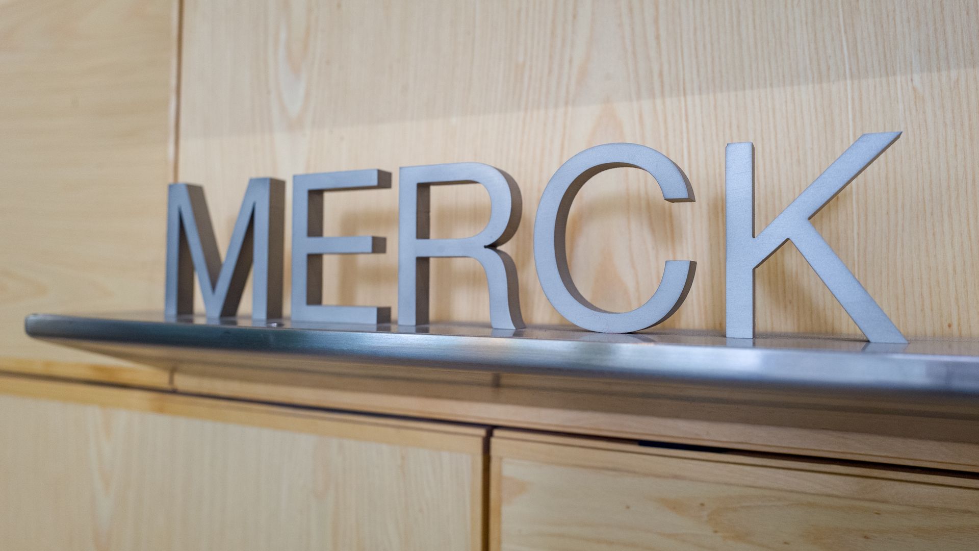 A Merck logo.