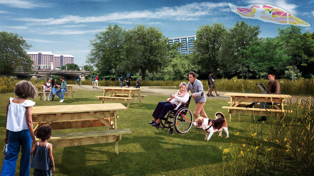 more people playing in a park. this time with a fat dog 