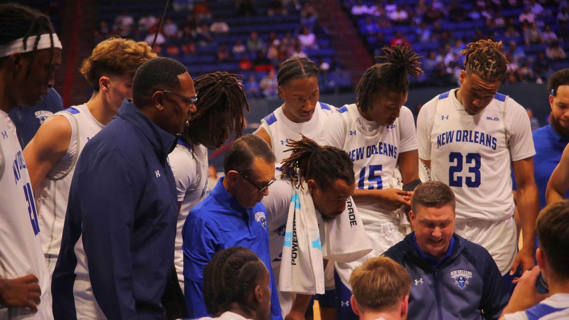 UNO head coach Stacy Hollowell and Coach P gather the team during a timeout against Sacramento State. Photo by Malcolm Porter