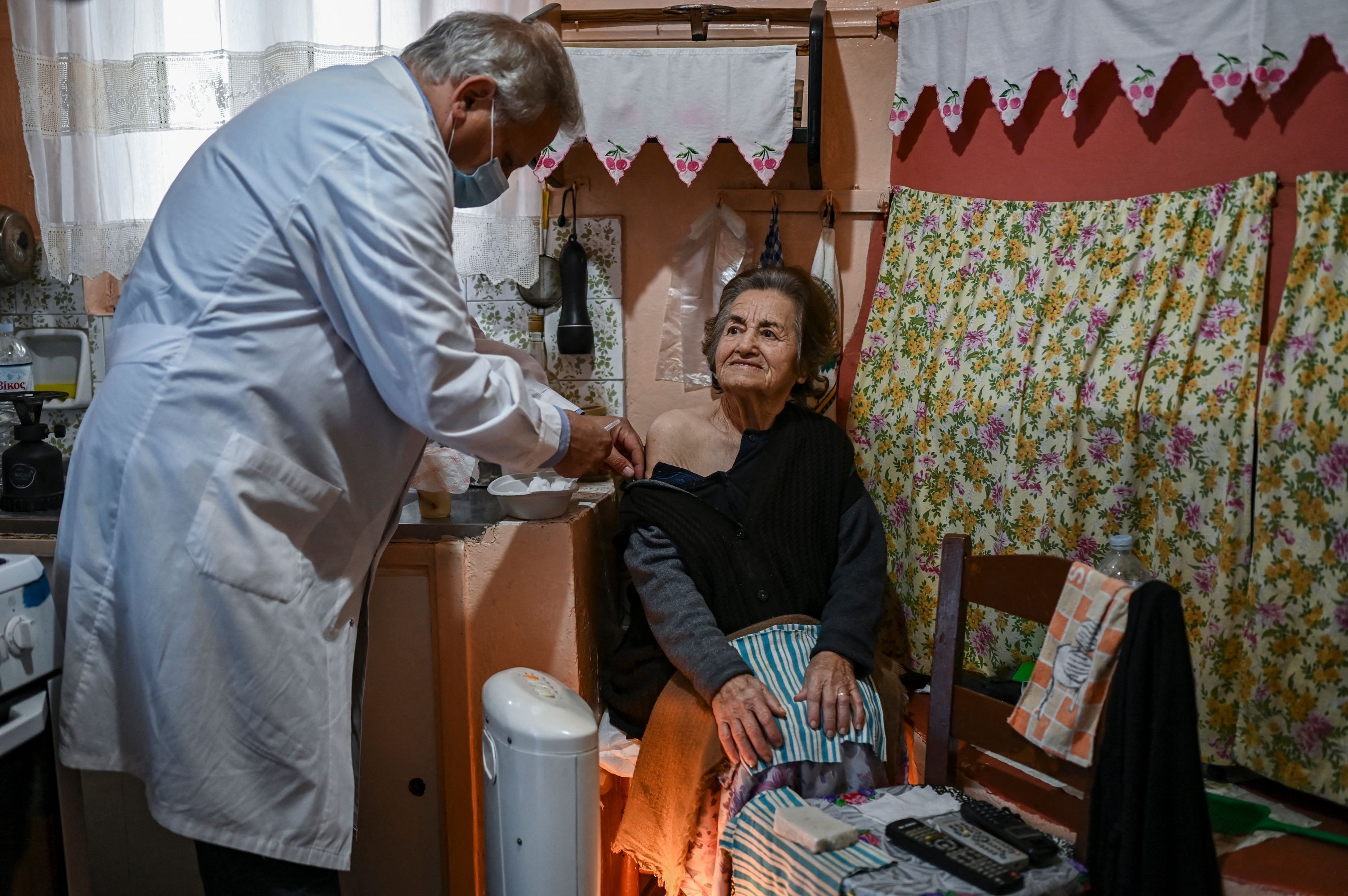 An elderly woman is vaccinated against Covid-19 on the Elafonissos Island, on April 23