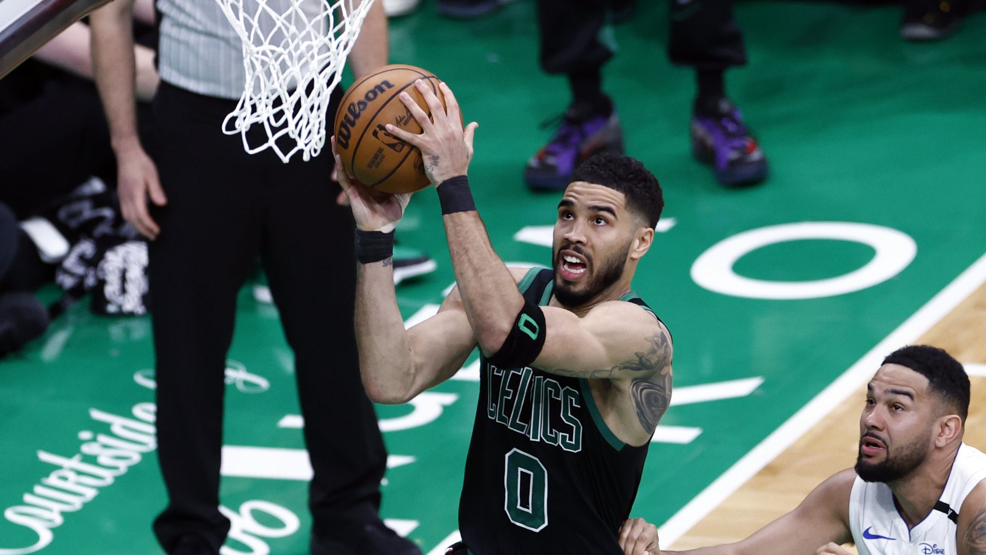 Boston, MA - April 29: Boston Celtics forward Jayson Tatum drives to the basket in the second quarter of Game 5 of the NBA Eastern Conference playoffs against the Orlando Magic at TD Garden.
