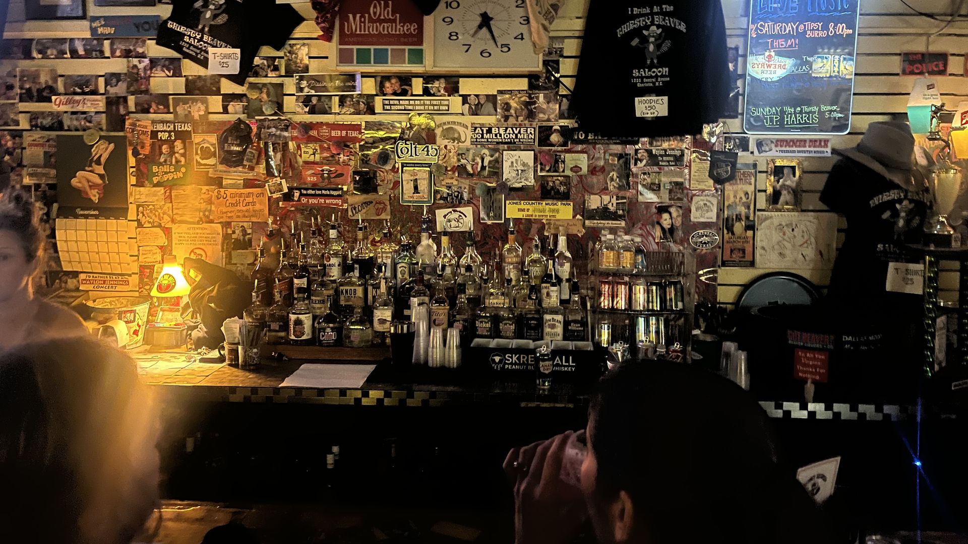 Bar with liquor bottles and wall decor