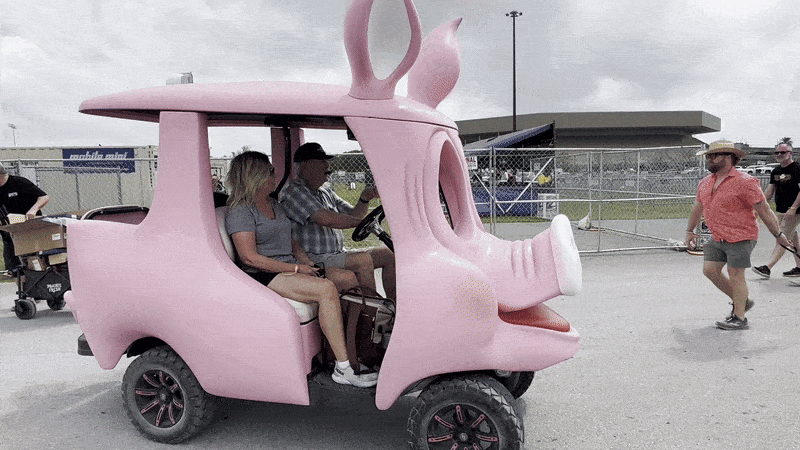 Photo shows a pig-themed golf cart.
