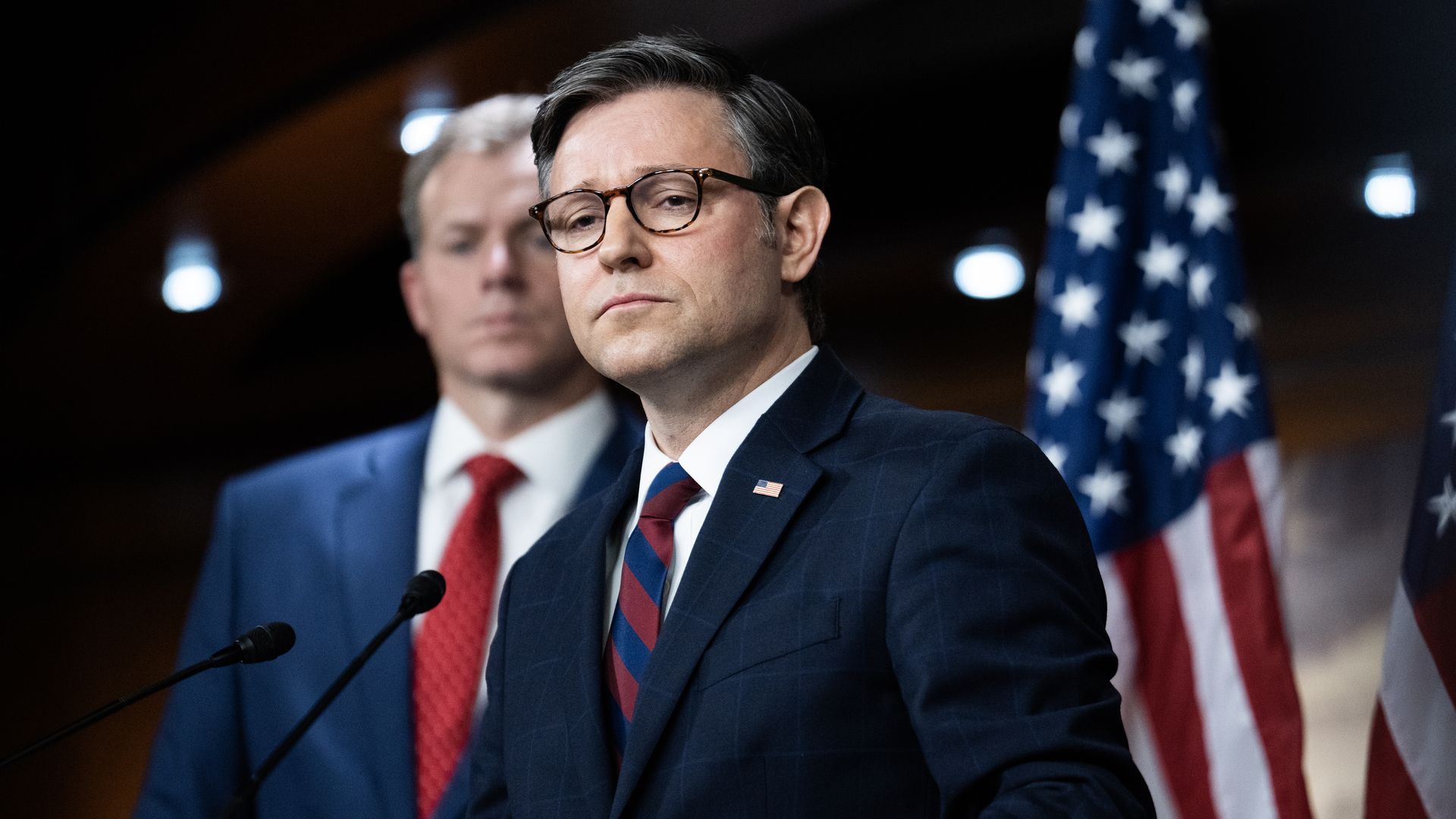 House Speaker Mike Johnson, wearing a blue suit and standing in the Capitol's Studio A.
