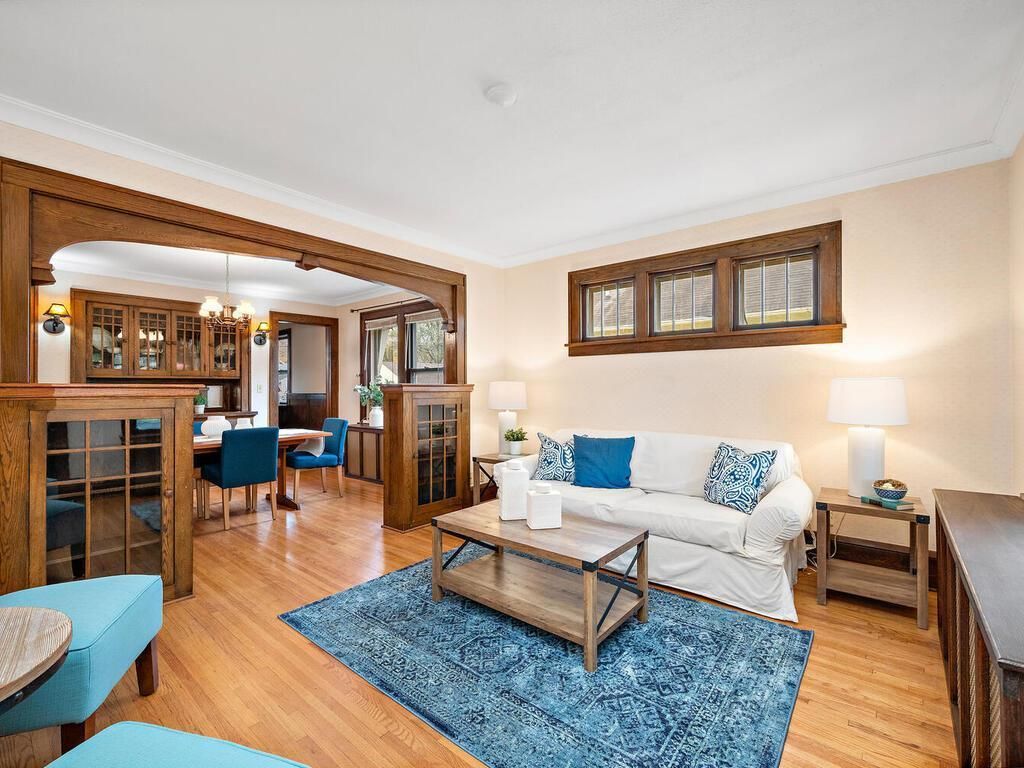 living area with view of dining area and built ins