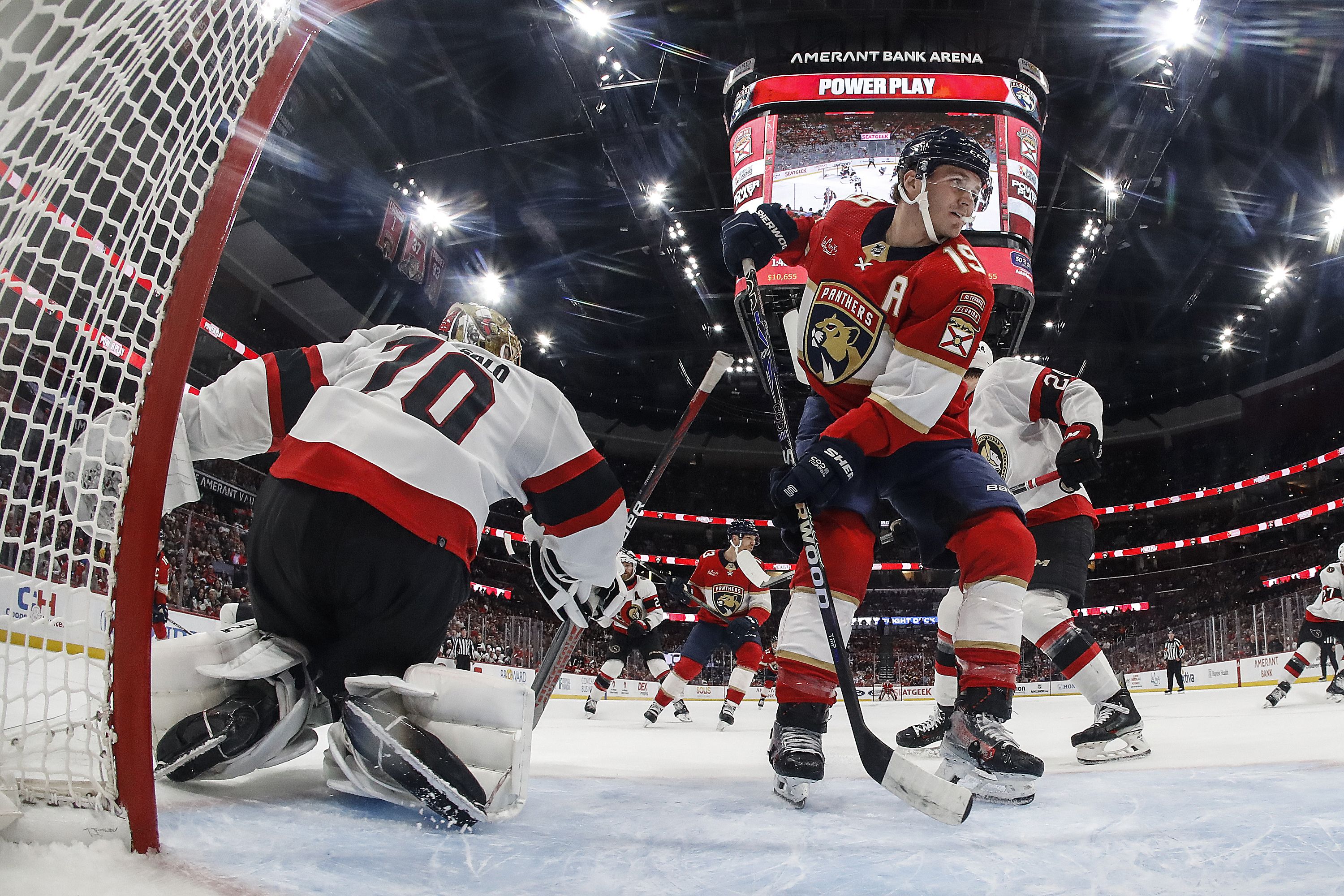 Goaltender Joonas Korpisalo #70 of the Ottawa Senators defends the net against Matthew Tkachuk #19 of the Florida Panthers at the Amerant Bank Arena on April 9, 2024 in Sunrise, Florida.