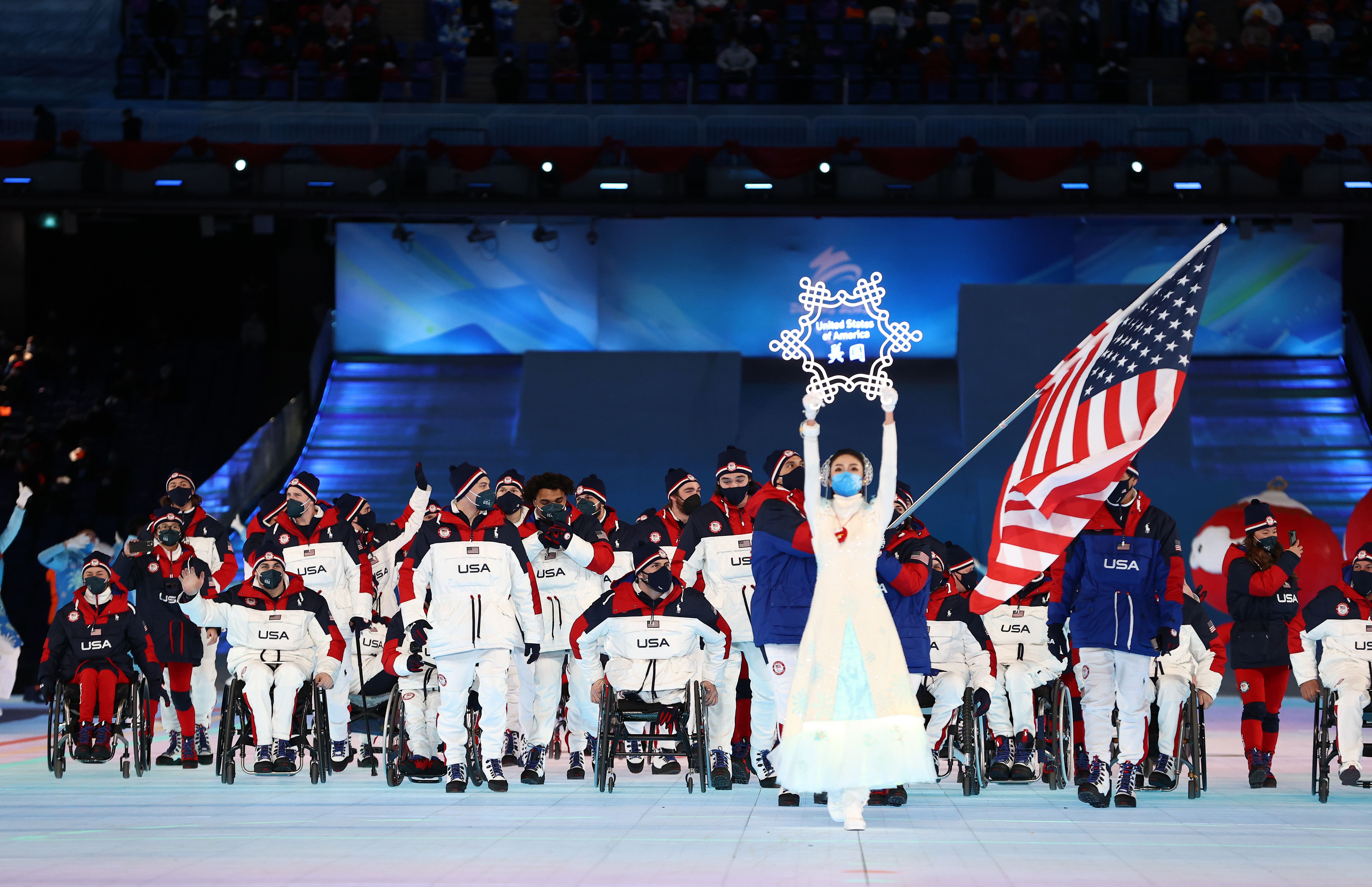  Flag bearers Tyler Carter and Danelle Umstead of Team United States lead their team out during the Opening Ceremony.