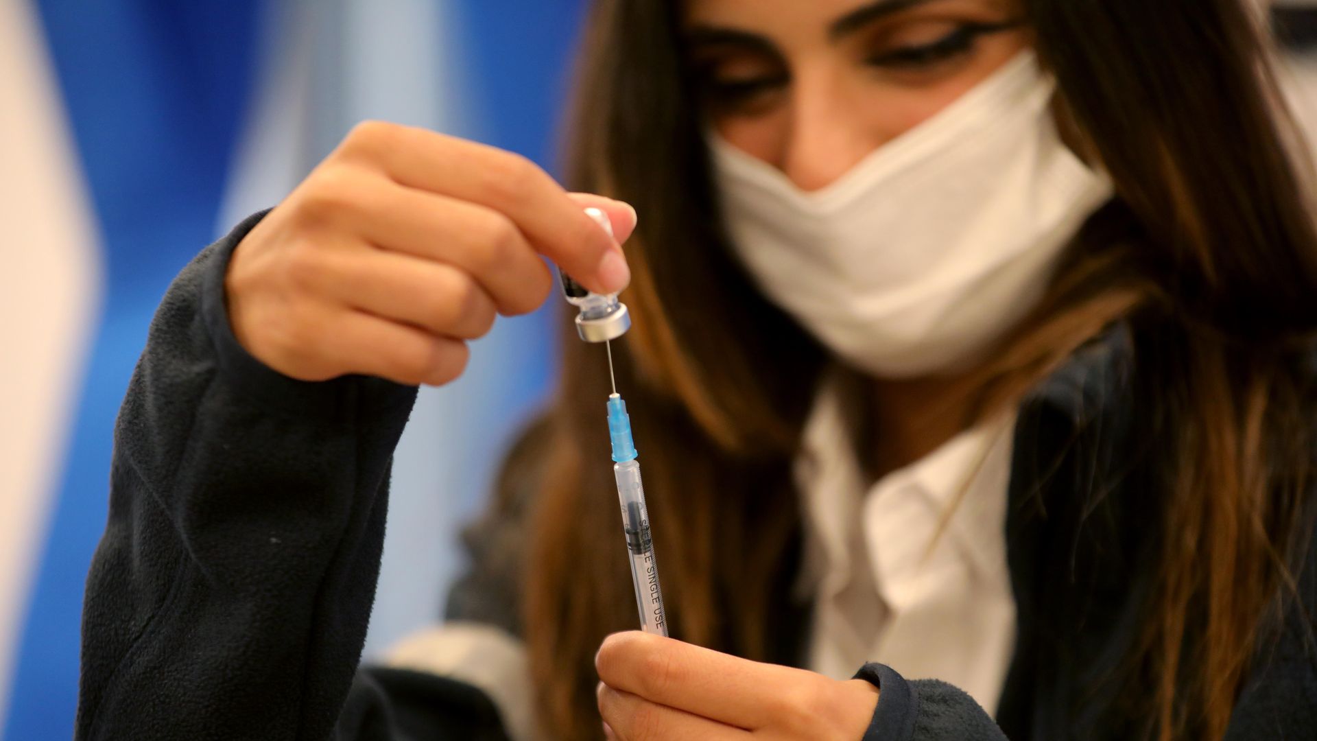 A health worker preparing a dose of coronavirus vaccine in Modi'in in October 2021.