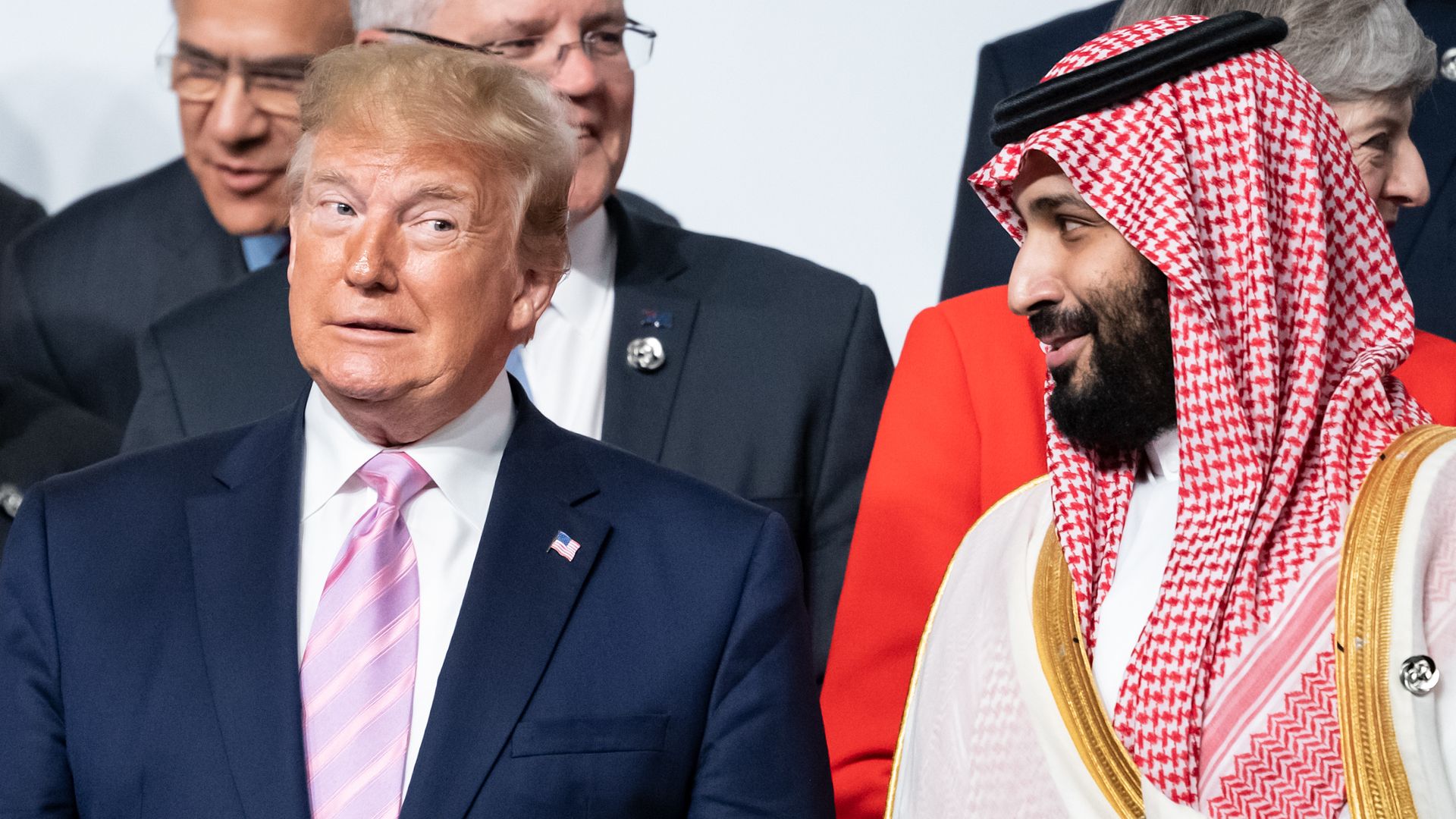 In this image, Trump and MBS speak in a friendly way to each other.
