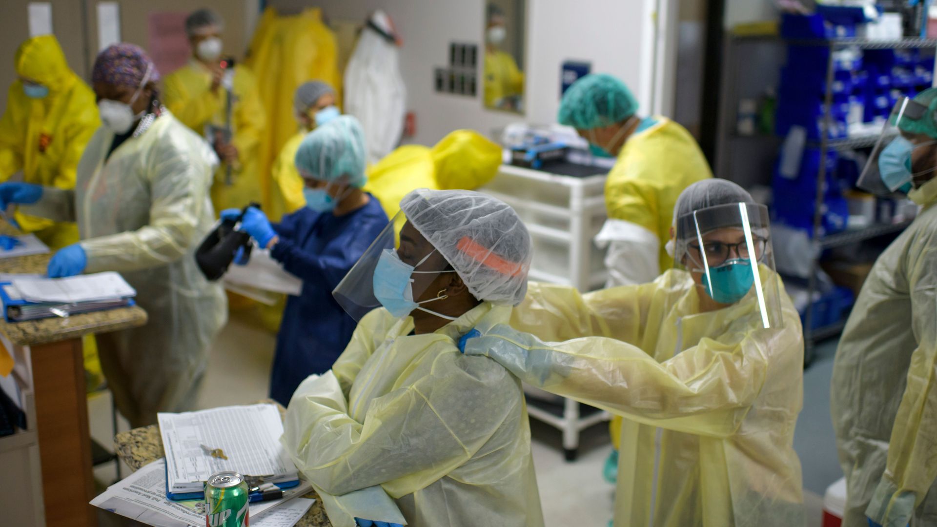 A healthcare worker gives another a shoulder rub before they go back into the the Covid-19 Unit at United Memorial Medical Center in Houston, Texas, July 2