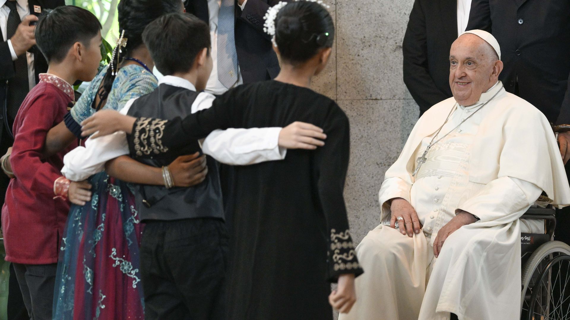 Pope Francis is greeted as he arrives at Changi Airport on September 11, 2024 in Singapore