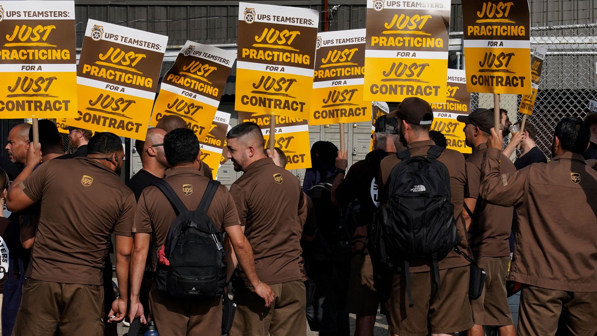 UPS workers walk a "practice picket line" in New York City earlier this month.