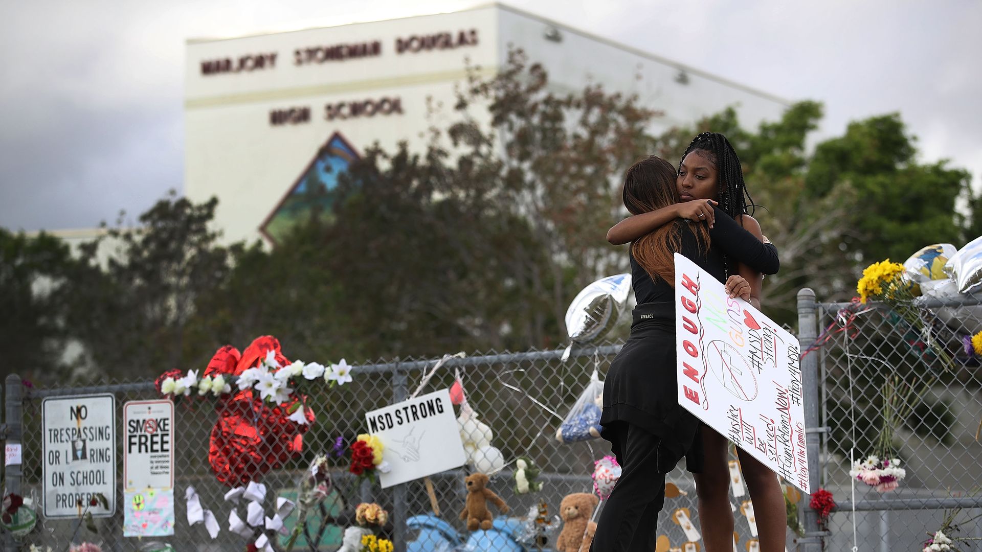 Students comforting each other after a shooting at Marjory Stoneman Douglas High School in Parkland, Florida