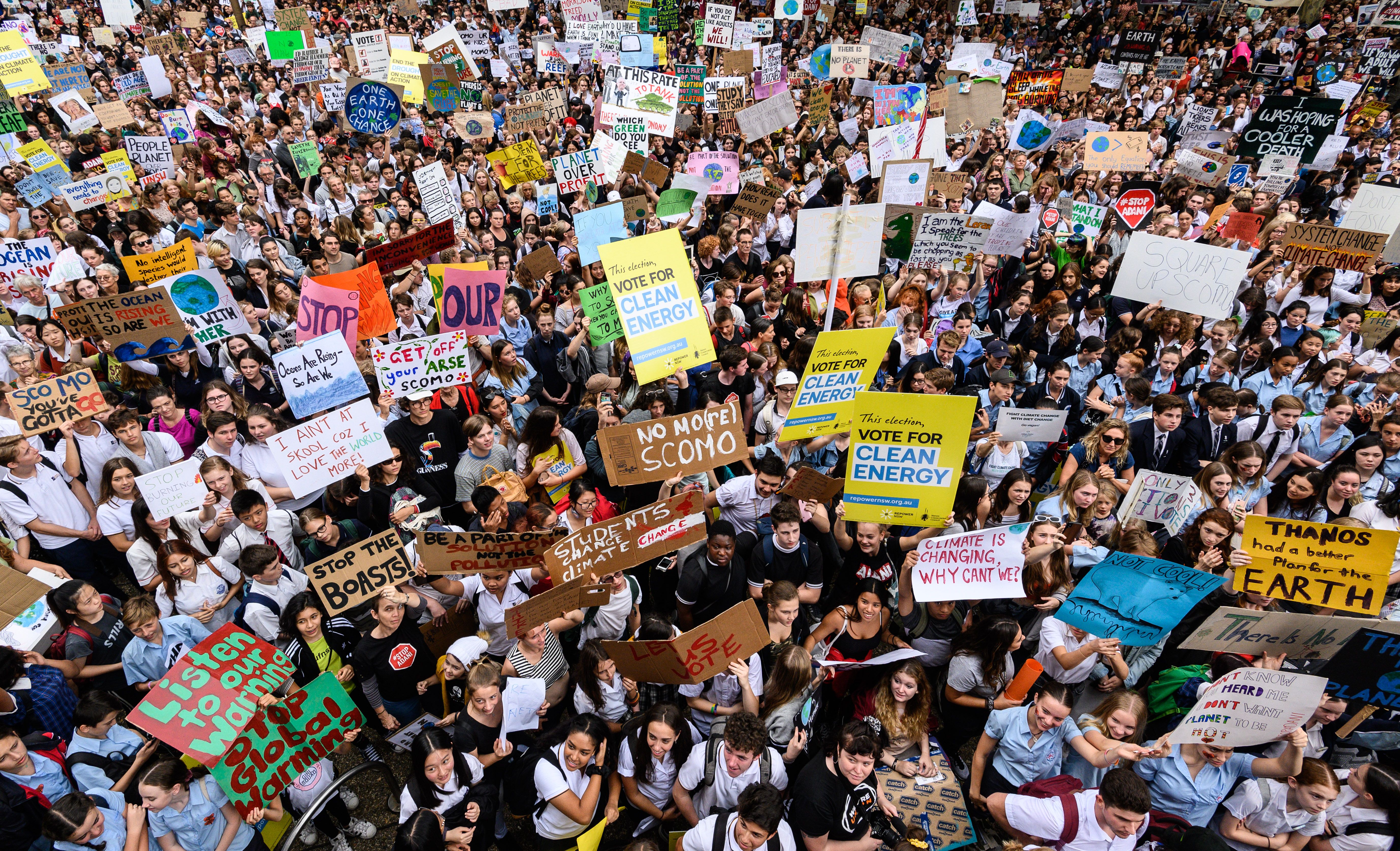 A sea of student protestors holding signs in Australia. 