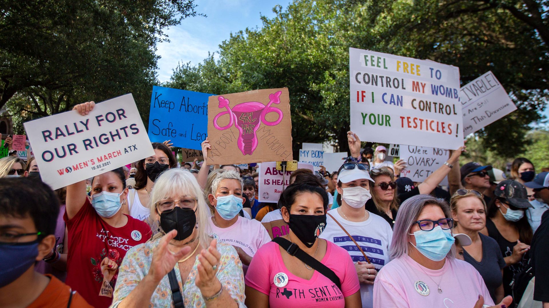 Picture of people holding signs in support of reproductive rights
