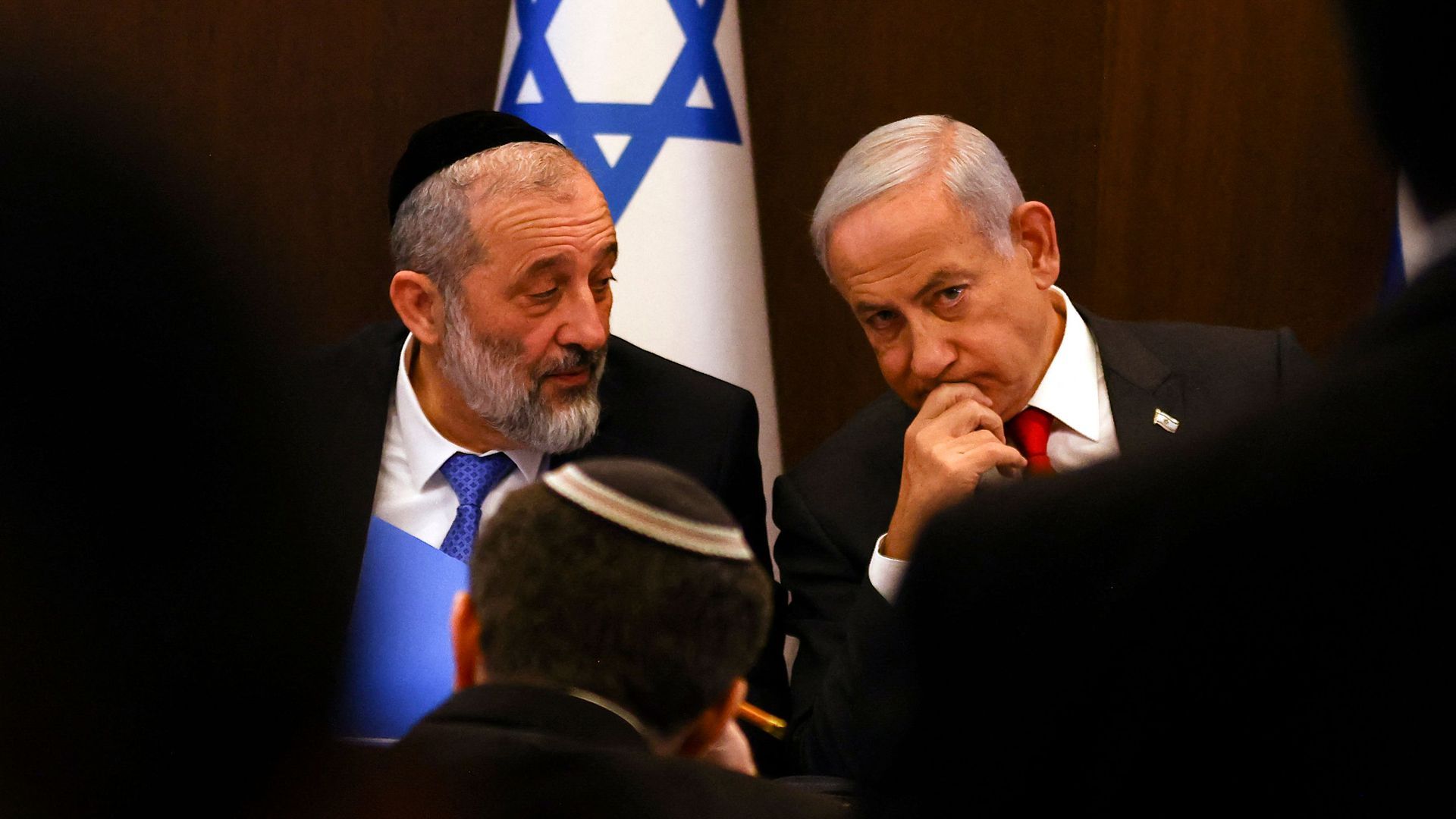 Israeli Interior Minister Aryeh Deri and Prime Minister Benjamin Netanyahu talk at a Cabinet meeting on Jan. 8. Photo: Ronen Zvulum/AFP via Getty Images