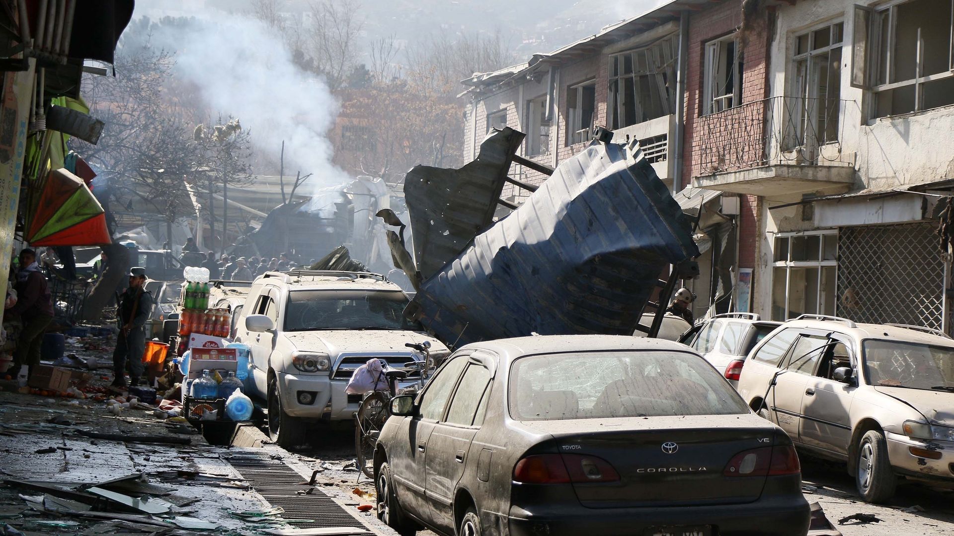 aftermath of a suicide car bombing on a Kabul street