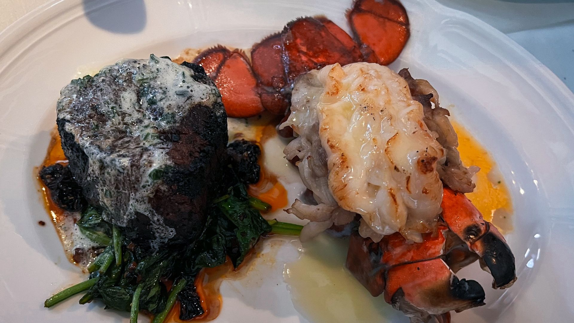 A steak filet and lobster.