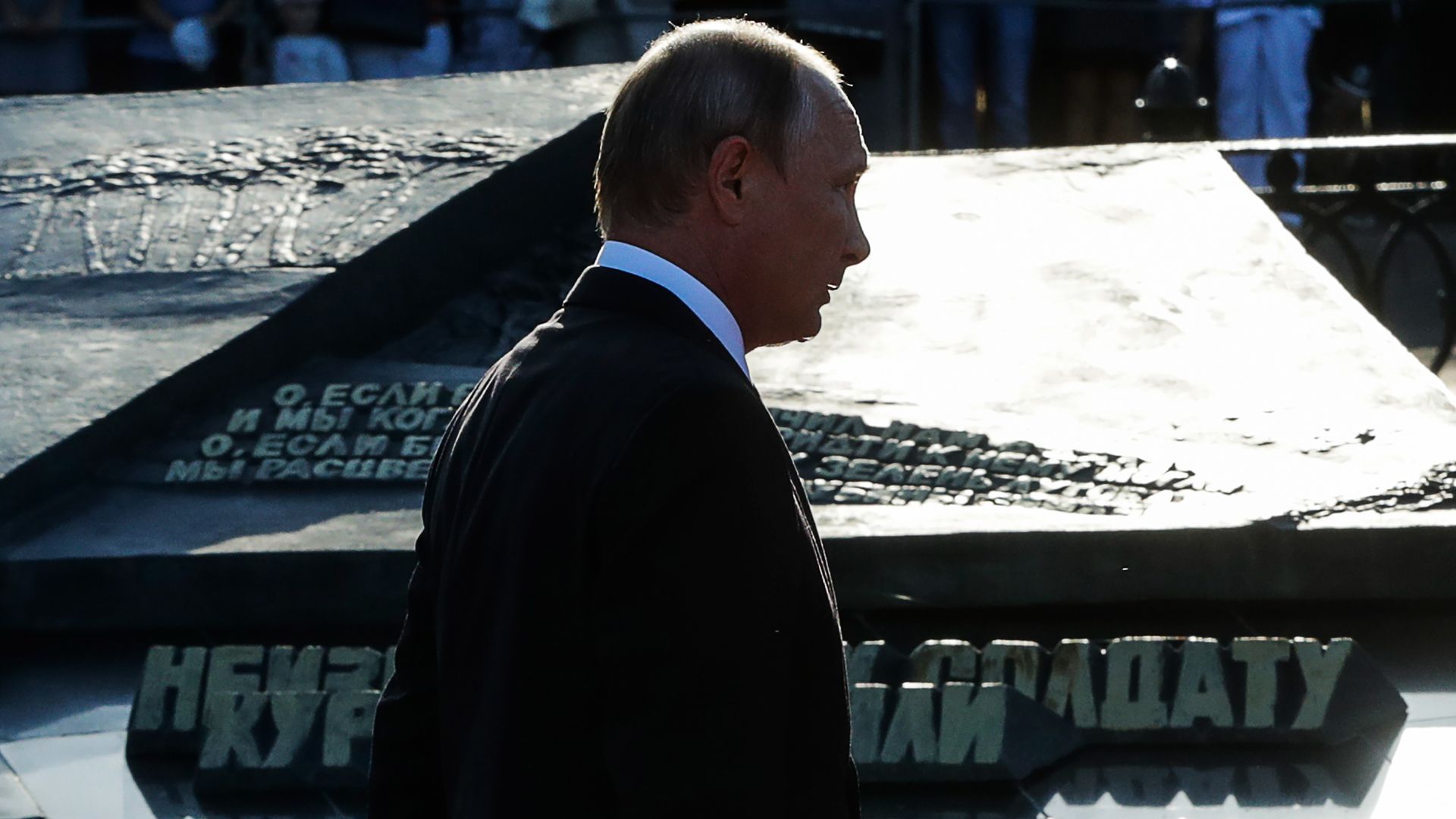 Vladimir Putin's profile as he's walking in a shadow