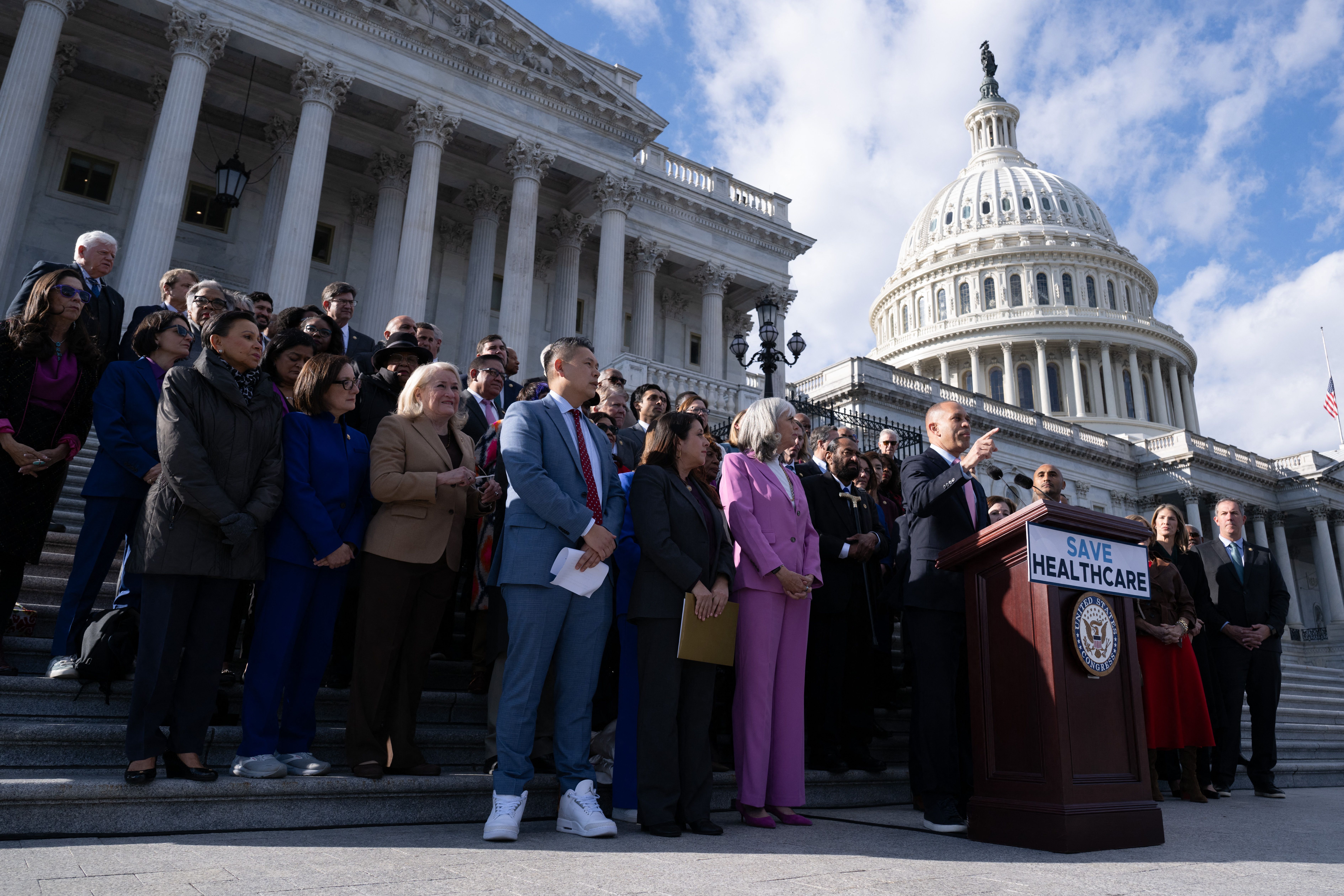 House Minority Leader Hakeem Jeffries speaks outside the Capitol yesterday before a vote to end the government shutdown. 