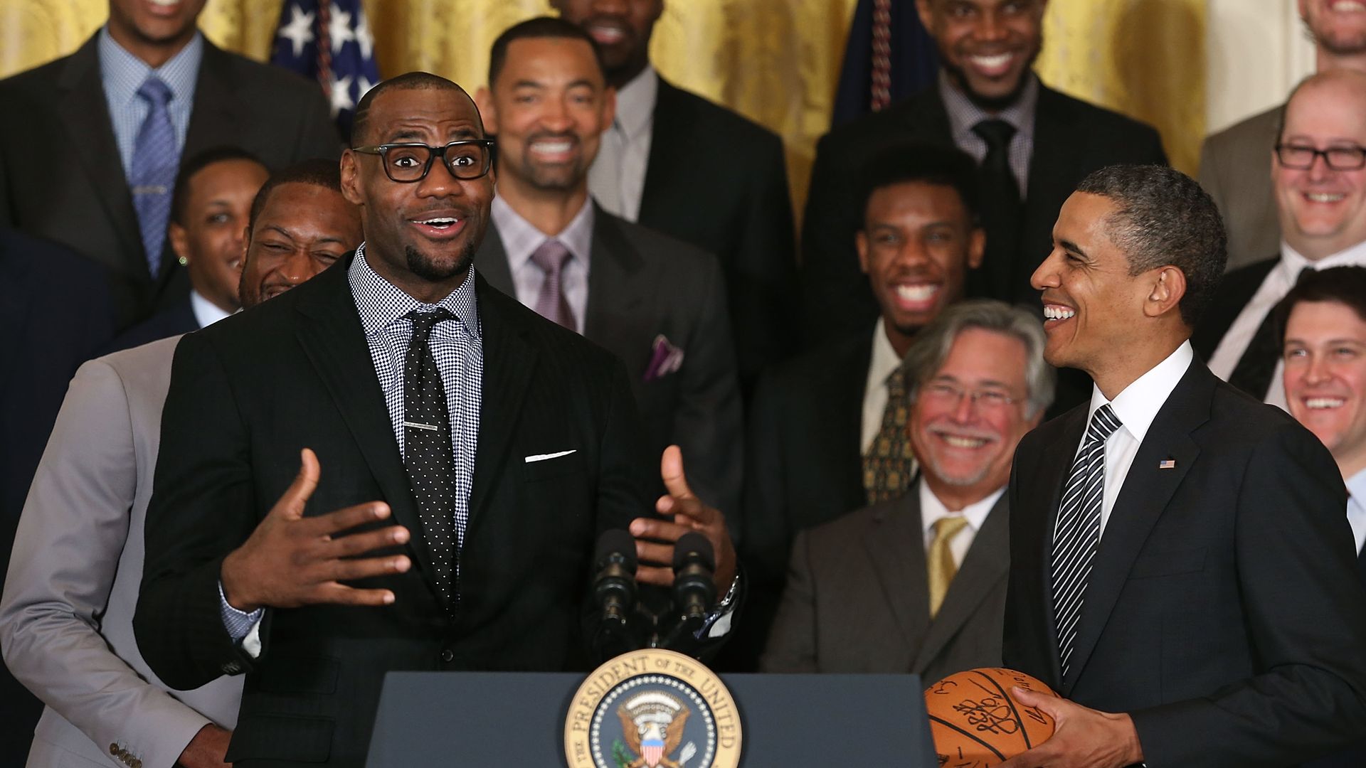 LeBron James (L) speaks to U.S. President Barack Obama (R) during an event to honor the NBA champion  in the East Room at the White House on January 28, 2013 in Washington, DC. 
