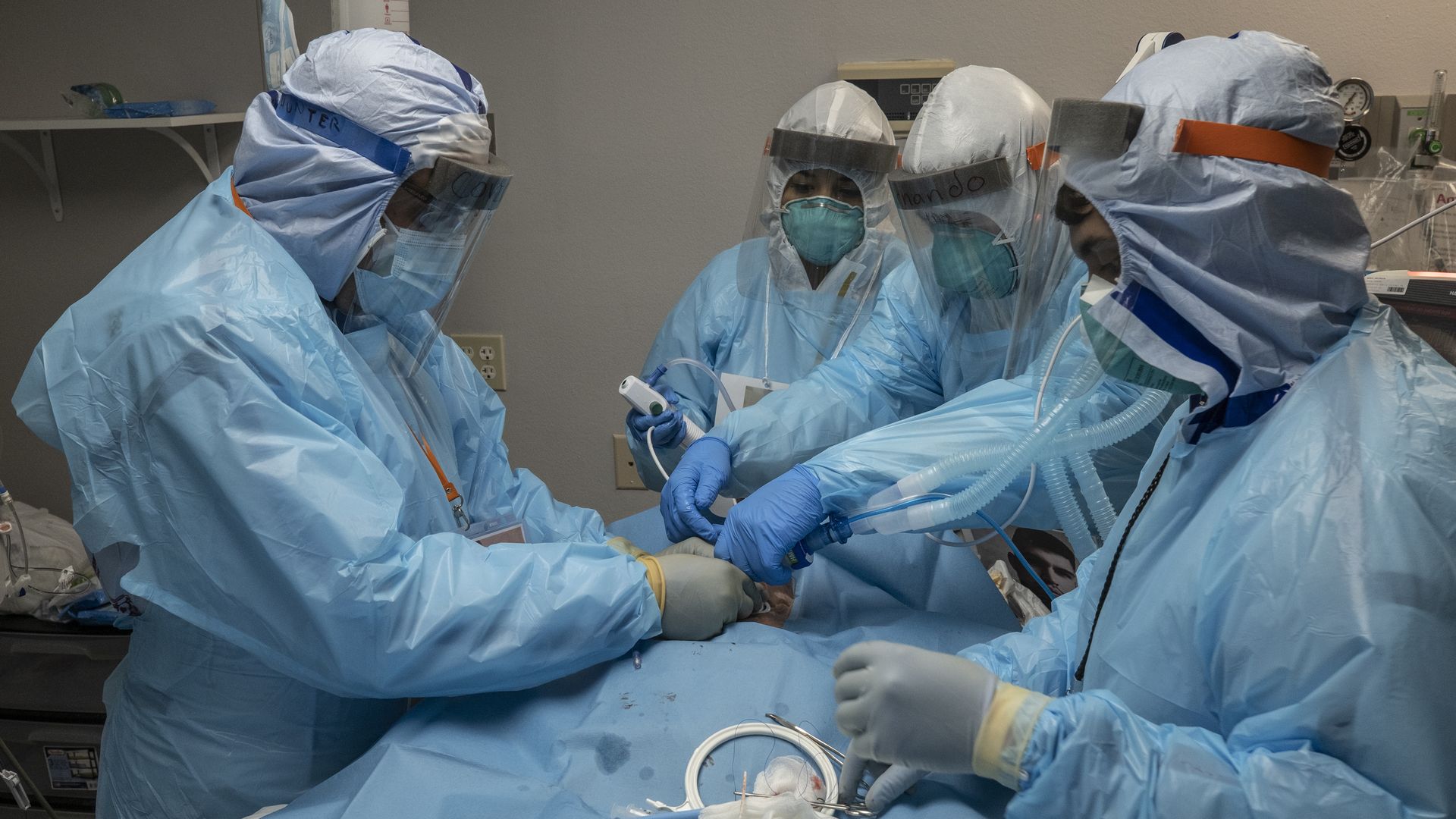 Caption: Hospital staff work in the COVID-19 intensive care unit in Houston.