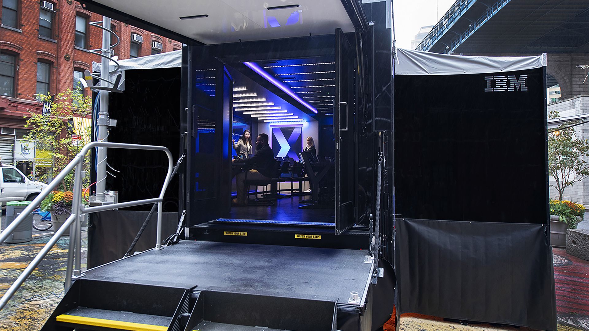 A picture of a door opening into IBM's mobile cybersecurity unit on a truck.