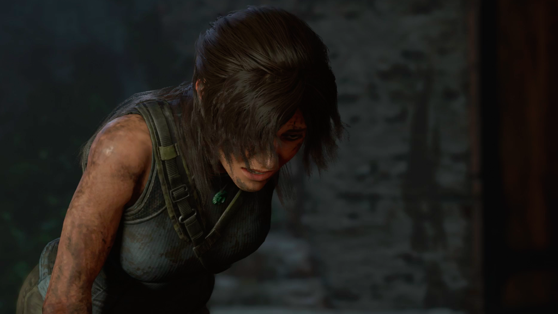 Video game screenshot of a woman in a tank top leaning over, scuffed with mud, grimacing