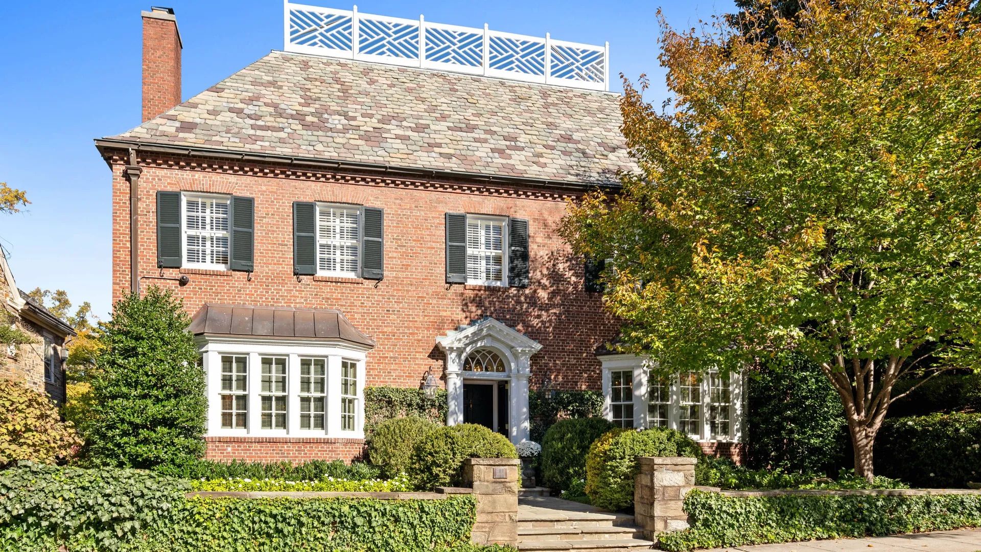 A photo showing the exterior of a brick home in Washington, D.C.'s Kalorama neighborhood.