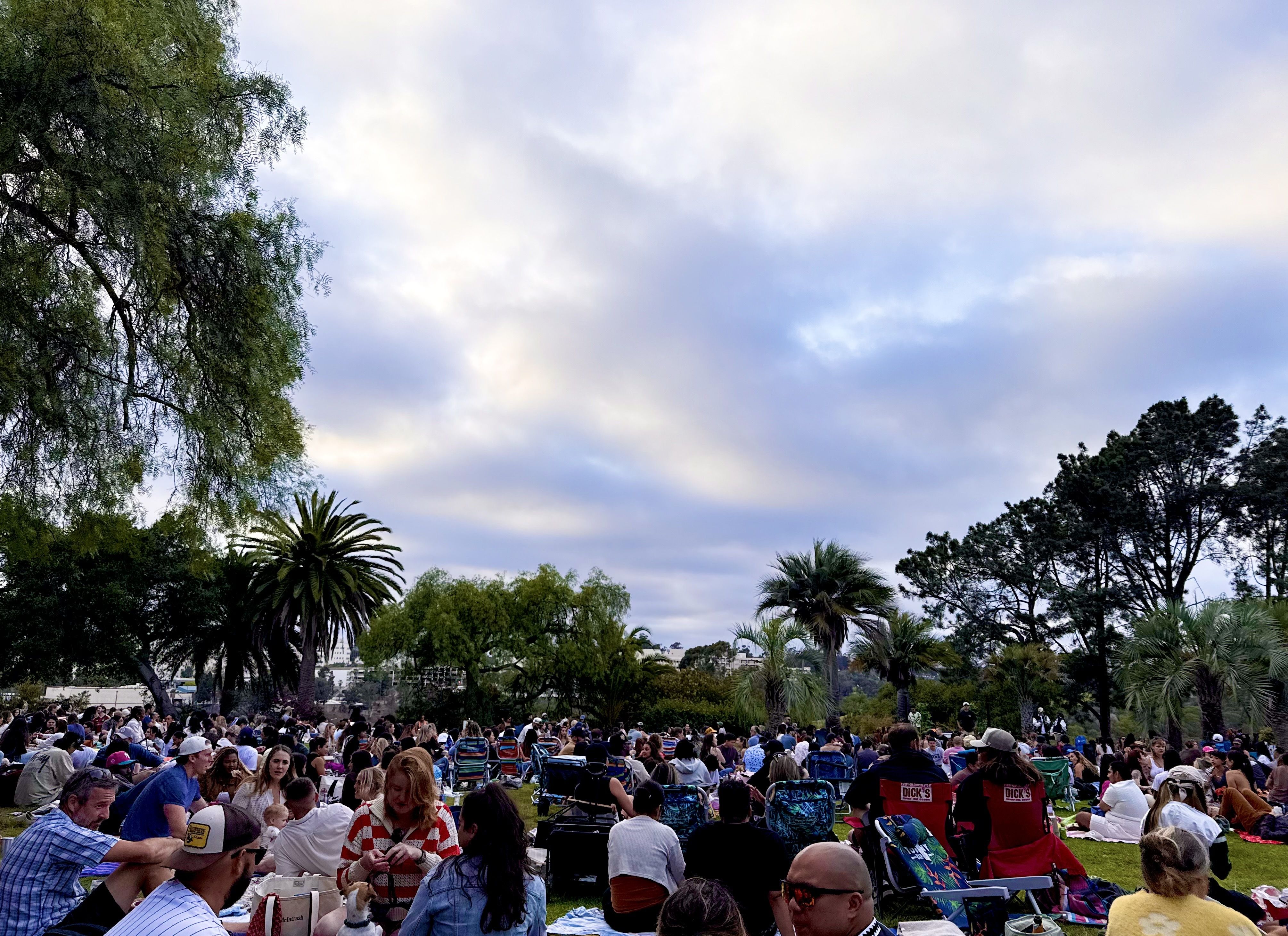 A large crowd gathers to see a DJ