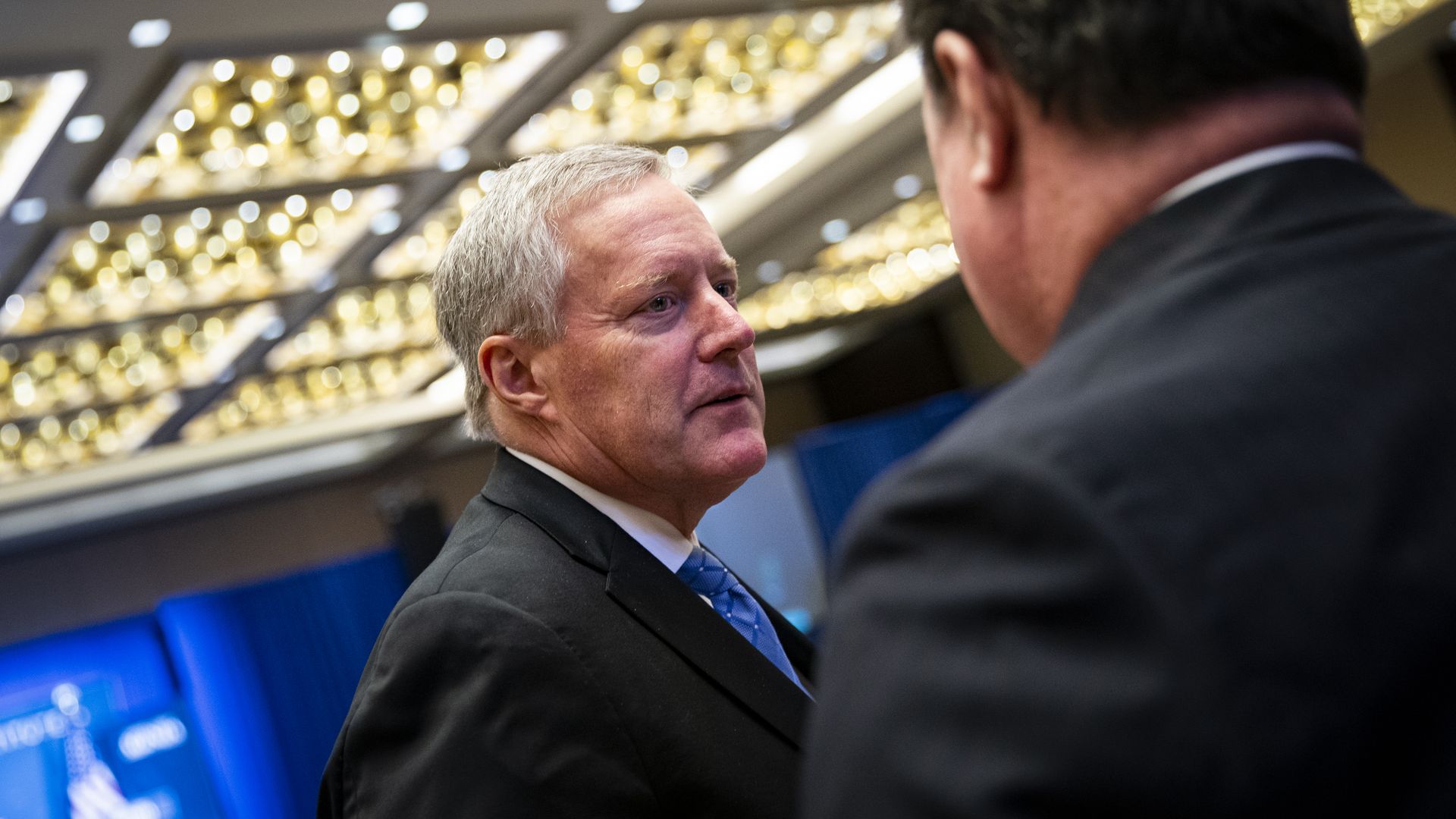 Mark Meadows, former White House chief of staff, speaks with an attendee during the America First Policy Institute's America First Agenda summit in Washington, D.C., US, on Monday, July 25, 2022. 