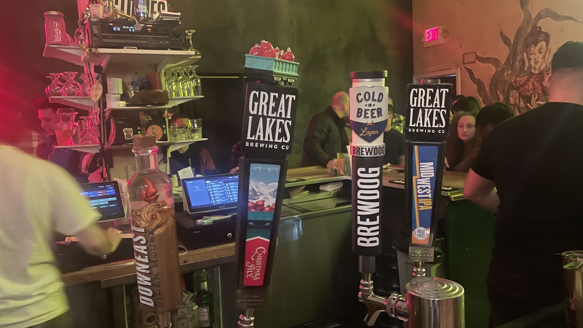 Photo of four taps at a bar 
