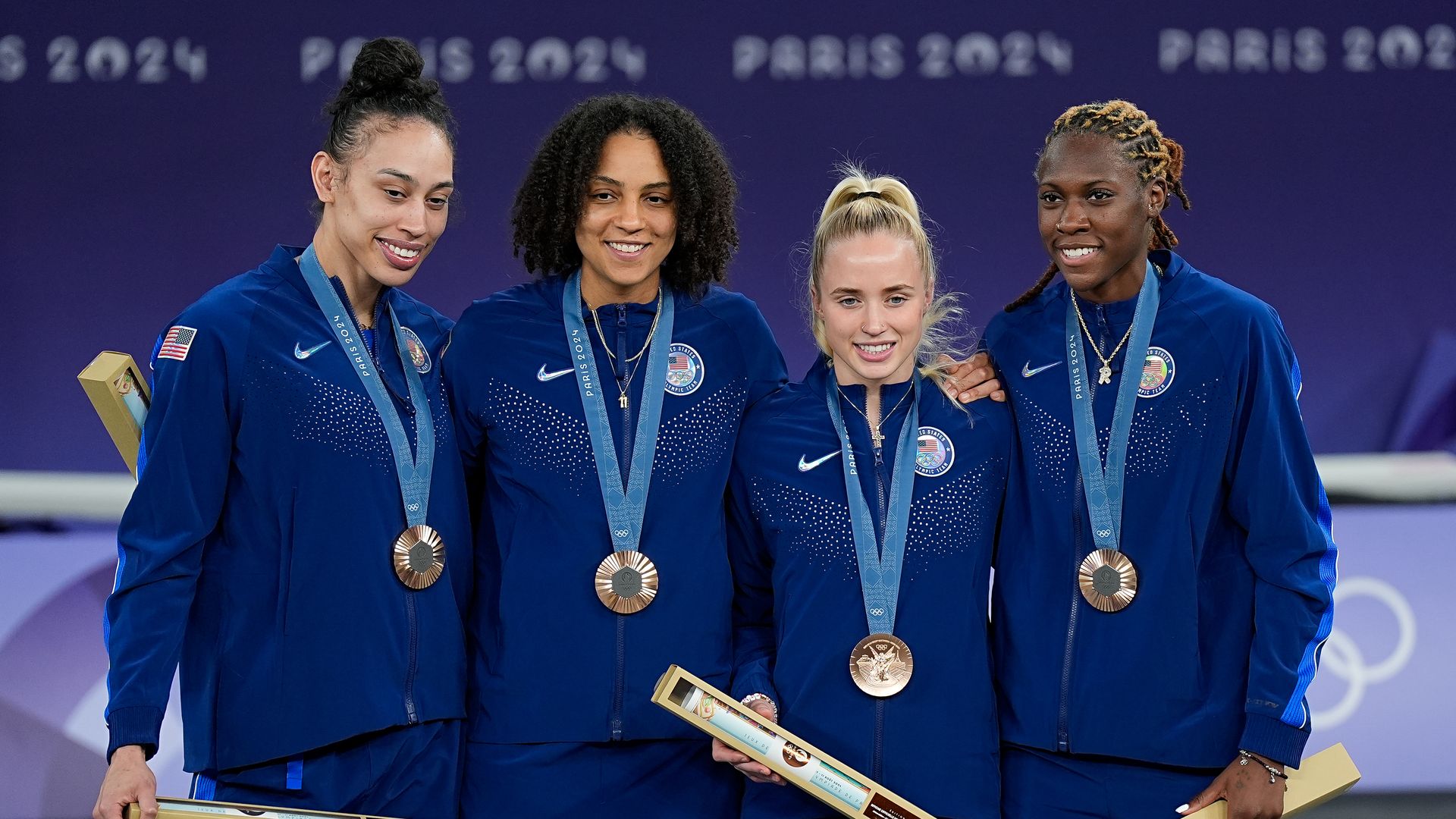 (From left) Team USA's Dearica Hamby, Cierra Burdick, Hailey Van Lith and Rhyne Howard win bronze in women's 3x3 basketball. Photo: Daniela Porcelli/Eurasia Sport Images/Getty Images