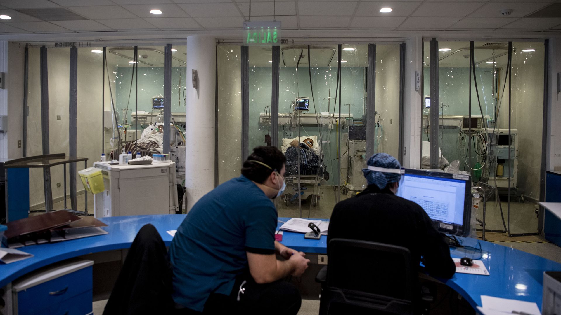 Doctors from the Critical Patients Unit prepare to check patients infected with COVID-19 at Barros Luco Hospital, in Santiago, on June 24