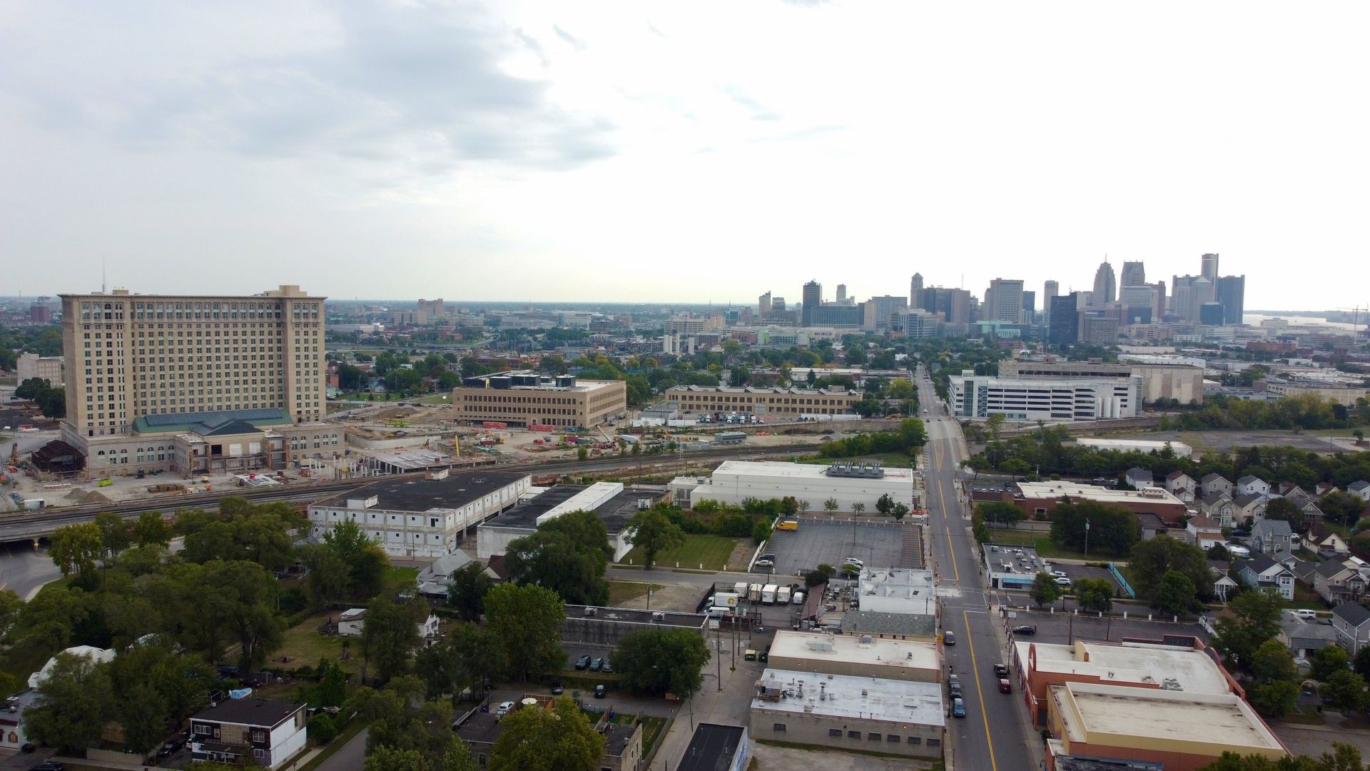 The cityscape with Michigan Central Station in the foreground. An overhead drone shot.