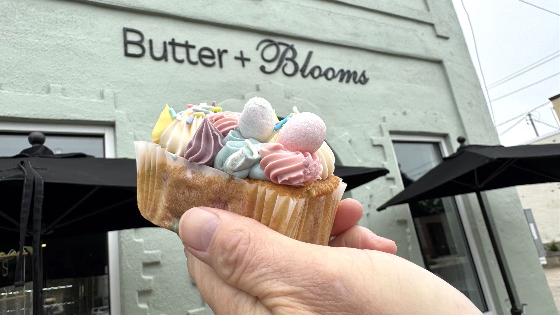 A small confetti cake with many colors of icing. 