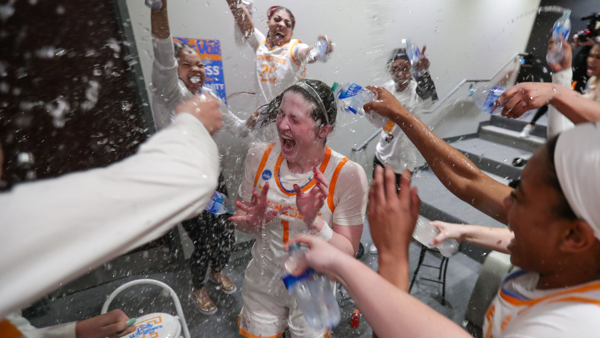 Tennessee players douse each other with bottled water.